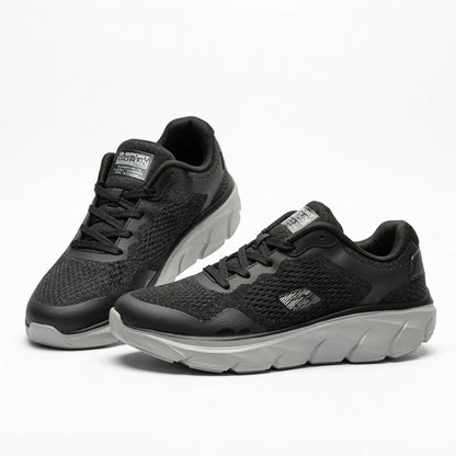 BAJO SHOES Chaussures de Sport Homme gris avec accents bleu et noir – paire en lévitation – GoRun Slip-Ins – semelle blanche ergonomique – mesh respirant – BAJO SHOES