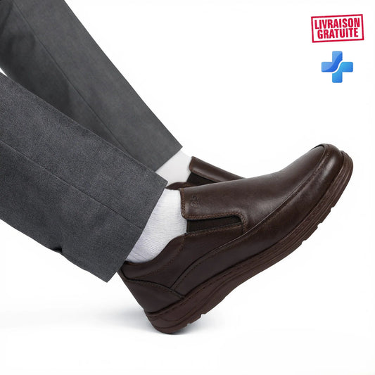 BAJO SHOES Ville Confortables black leather slip-on shoes – lifestyle shot worn walking with grey pants – everyday comfort – BAJO SHOES ville confortables